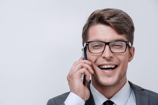 close up.businessman talking on the phone.isolated on white background