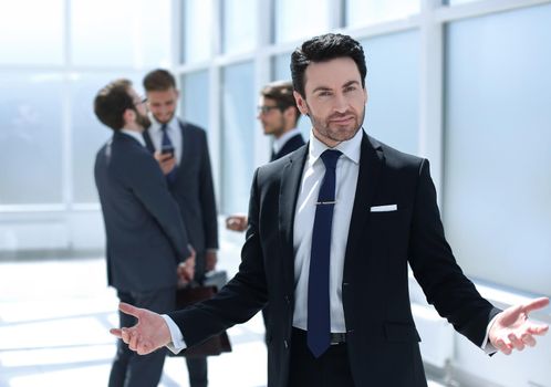 friendly businessman standing in the office.photo with copy space