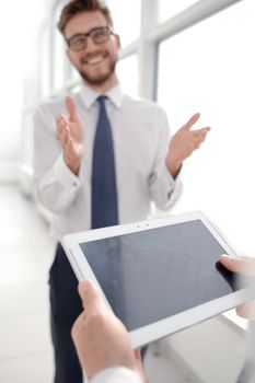 close up.businessman with digital tablet on office background.business and technology