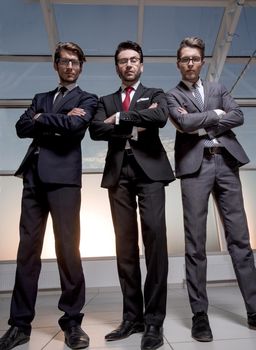 in full growth.three confident businessmen look forward.business concept