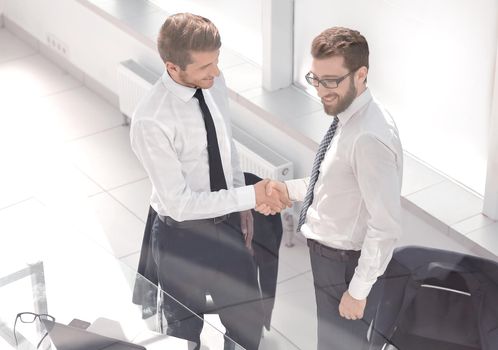 welcome handshake business people in the office.photo with space for text