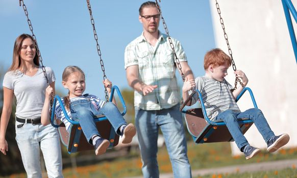 happy modern family spends their free time together .the concept of family entertainment