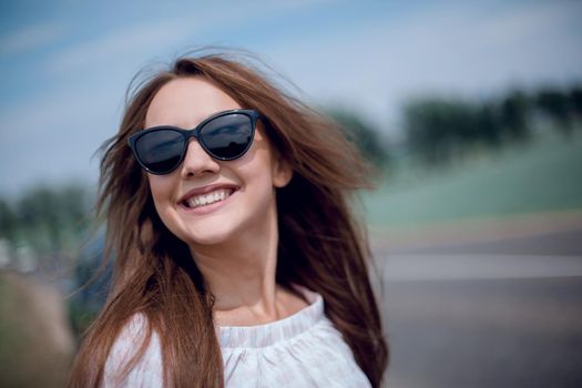 close up.portrait of a beautiful young woman in the car