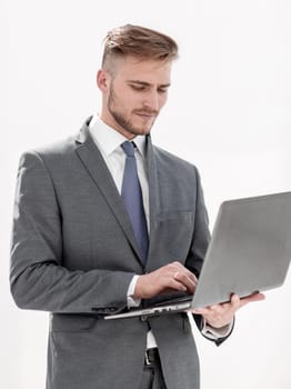 close up.businessman examines a new laptop.isolated on white