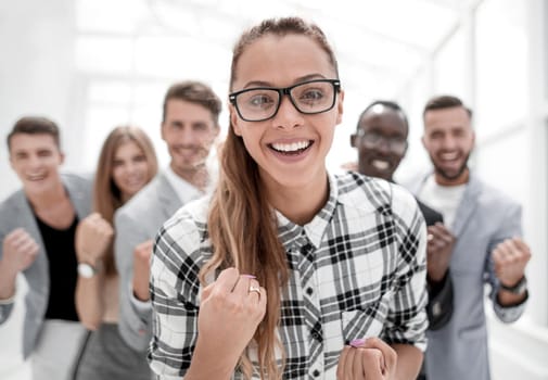Portrait of happy glad successful multinational business group in meeting room