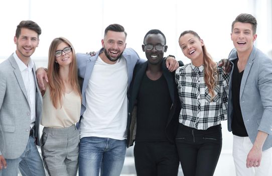 Portrait of business group standing confidently on white background