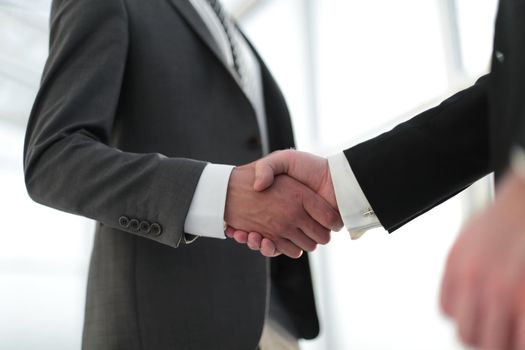 close up. handshake business partners .the concept of cooperation