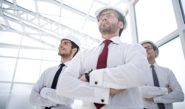 architect and designers standing in an empty office.photo with copy space