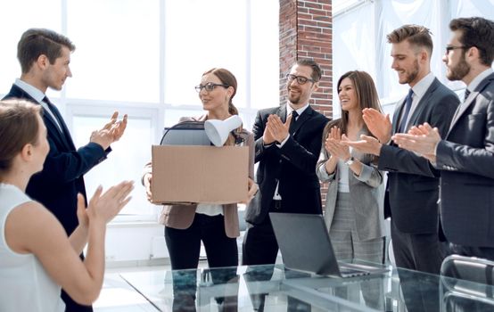 business team applauds the new employee on the first working day. the concept of employment