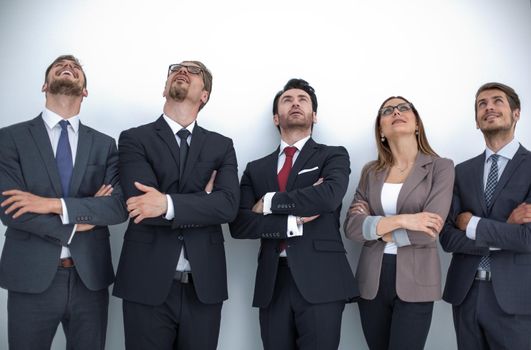 Happy positive business group looking up with dreaming expression.photo with copy space