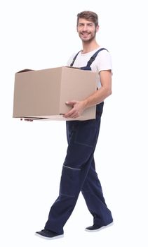 in full growth.a man carries a large cardboard box.isolated on white background