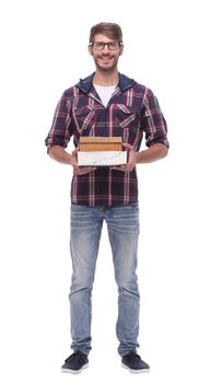 in full growth. smiling male student with books.isolated on white background.