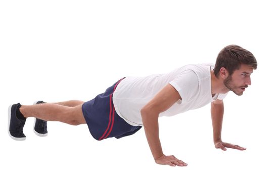 in full growth. a man performs a push-up from the floor.photo with copy space