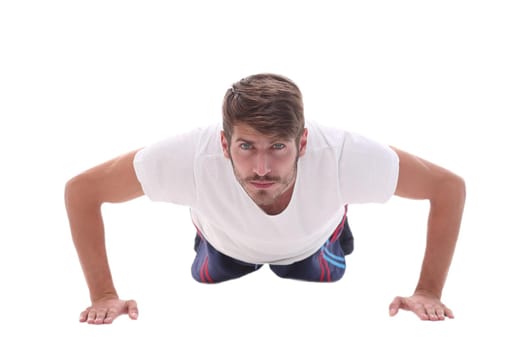 in full growth. a man performs a push-up from the floor.photo with copy space