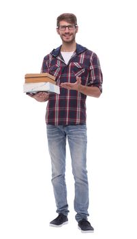 in full growth. smiling male student with books.isolated on white background.