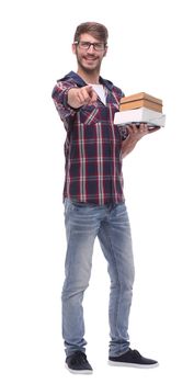 in full growth. smiling male student with books.isolated on white background.