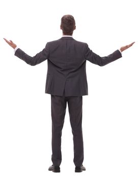 rear view. young businessman looking at copy space.isolated on white background