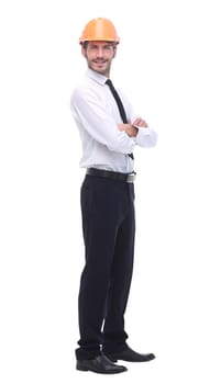 side view. young business man in a protective helmet.isolated on white background.