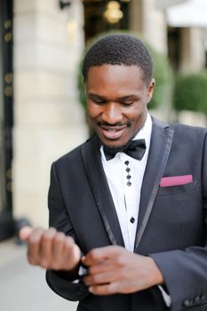 Afro american happy man wearing suit and smiling. Concept of black businessman.