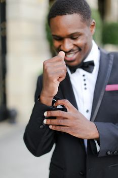 Afro american man wearing suit and smiling. Concept of black businessman.
