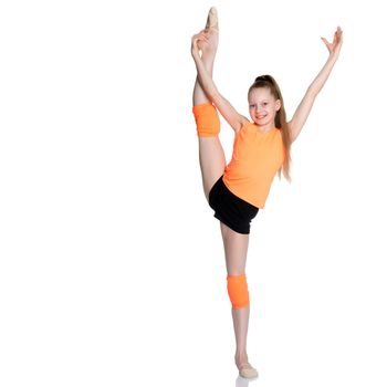 A girl gymnast balances on one leg.The concept of childhood, sport, a healthy lifestyle, physical development of personality. Isolated on white background.