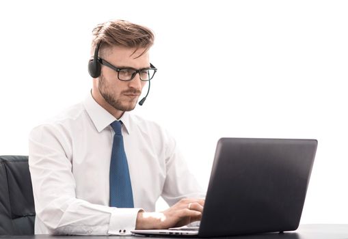 businessman in headphones working on a laptop.photo with copy space