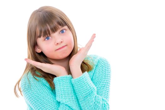 A charming little girl folded her hands around her face. The concept of beauty and fashion, children's emotions. Isolated on white background.