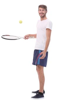 side view.smiling man with tennis racket. isolated on white background
