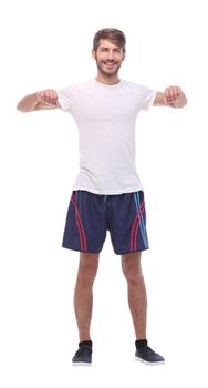 in full growth.smiling man performs morning exercises .isolated on white background