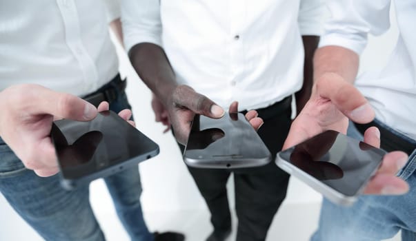 close up.business team using their smartphones.people and technology