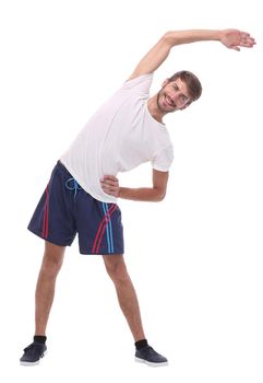 in full growth.smiling man performs morning exercises .isolated on white background