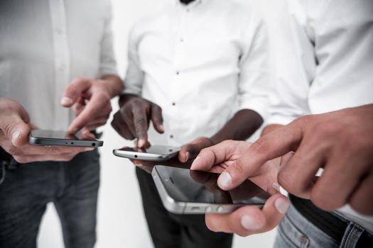 close up.a group of young people using their smartphones.people and technology