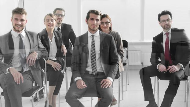 Group of employees talking and having fun in the business meeting