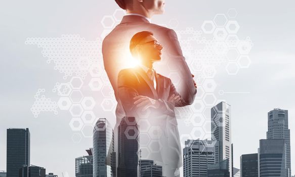 Double exposure of elegant businessman and modern busines city with towers and skyscrapers