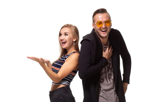 Couple watching look at something and have different emotions concept. Studio shot on white background. Copy space