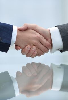 handshake business partners closeup in office