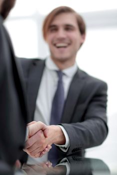 vertical photo.handshake business people .close up.