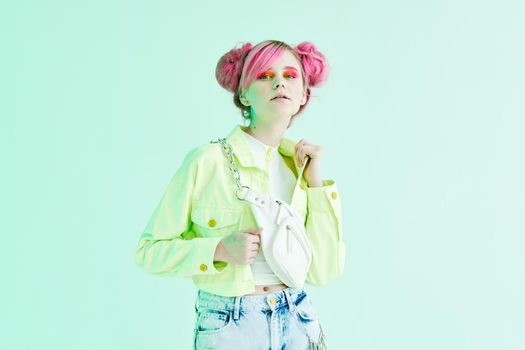 cheerful woman pink hair posing fashion clothes studio model. High quality photo