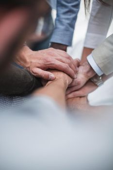 close up.business team putting their hands together.the concept of cooperation