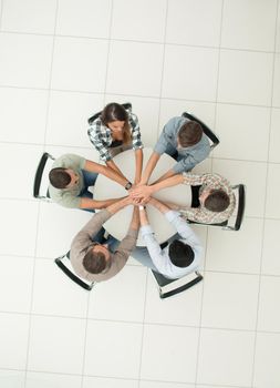 top view.single business team sitting at the round table .photo with copy space