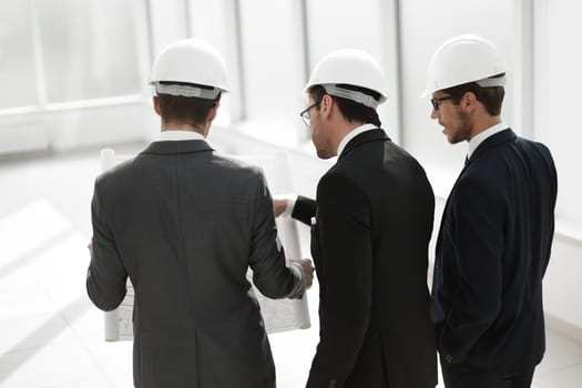 portrait of a confident businessman in a protective helmet. business people