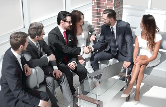 business colleagues greet each other at an informal meeting. meetings and partnerships