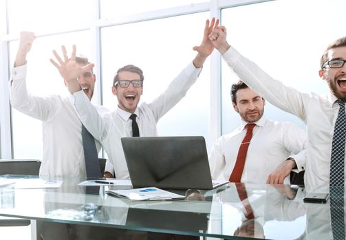 happy team showing their success.the concept of a successful startup