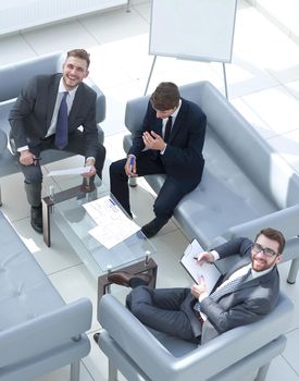 top view.business partners sitting in the meeting room.business concept