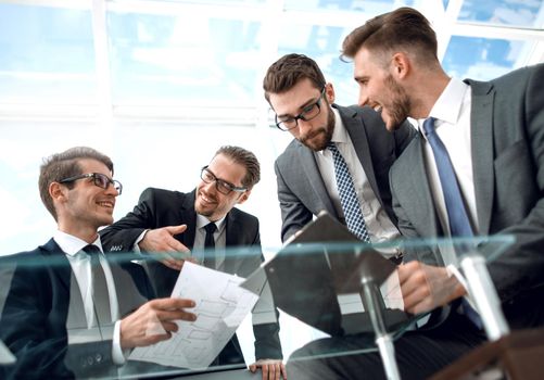 business partners study the terms and details of the contract .the concept of cooperation