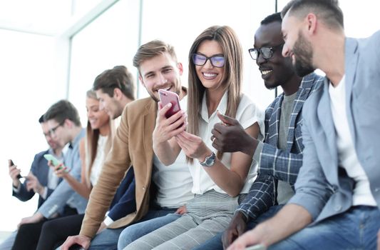 group of young people with smartphones.people and technology