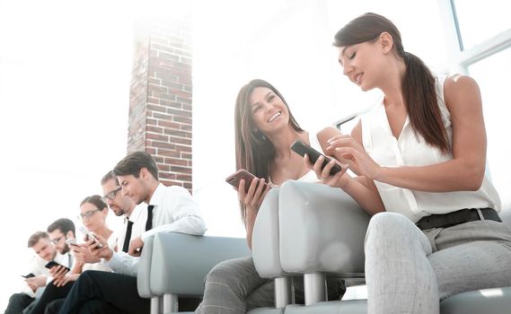 group of employees sitting in the office hallway.people and technology