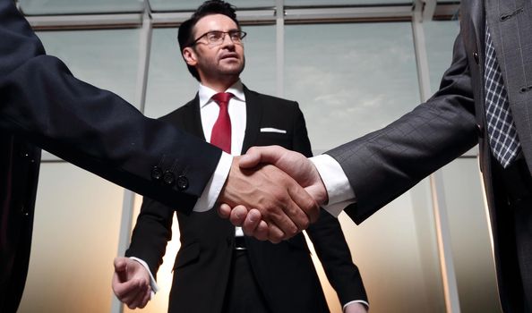 in the foreground.business handshake business partners .\the concept of cooperation