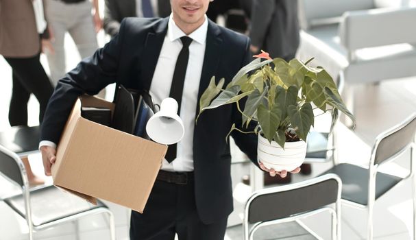 young employee standing in office on his first day.the concept of employment