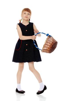 A little girl with a wicker basket made of willow twigs. The concept of family rest, harvesting, picking mushrooms and berries. Isolated over white background